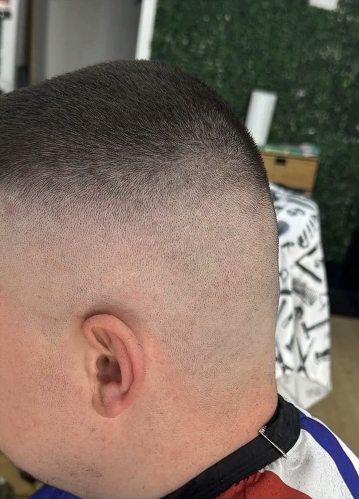 High skin fade cut at Zizo Barbers